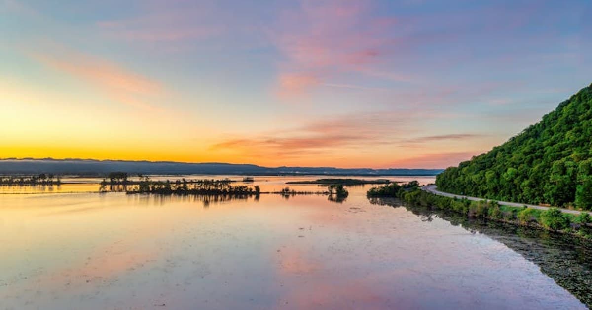 Vibrant sunset reflecting on the Mississippi River near Weaver, Minnesota.