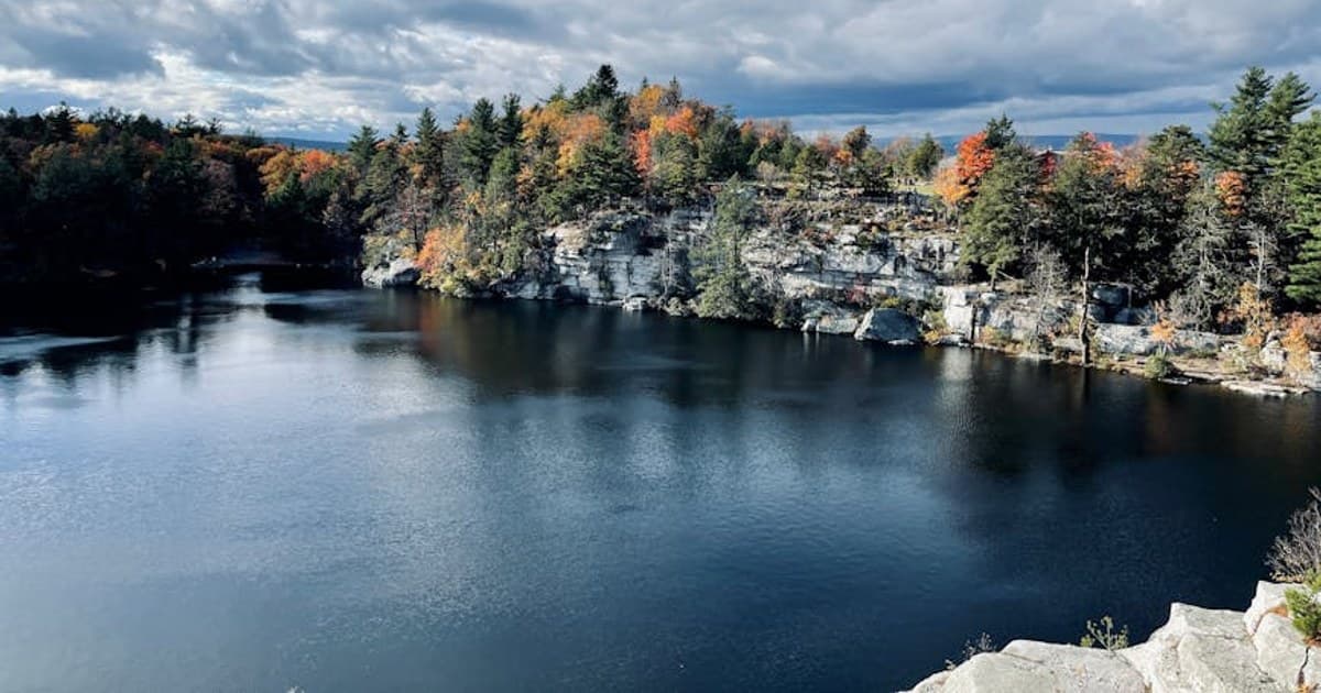 Aerial view of scenic lake surrounded by autumn foliage at Mohonk Preserve, Gardiner, NY.