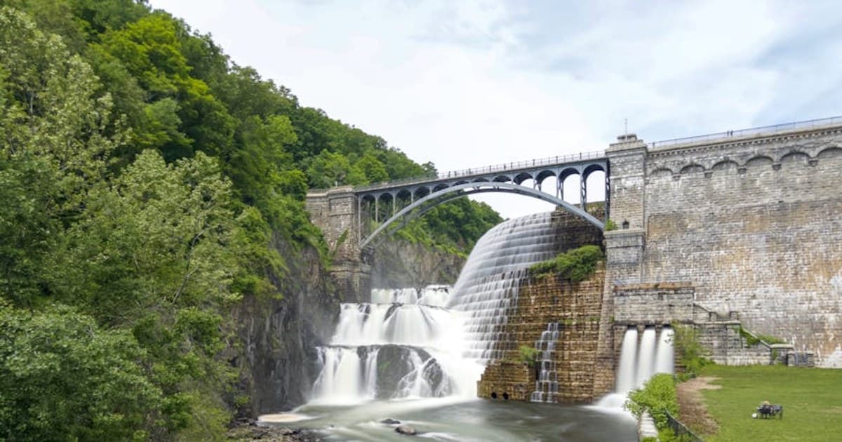 Breathtaking view of the Croton Dam and bridge surrounded by lush greenery in Croton-on-Hudson, NY.