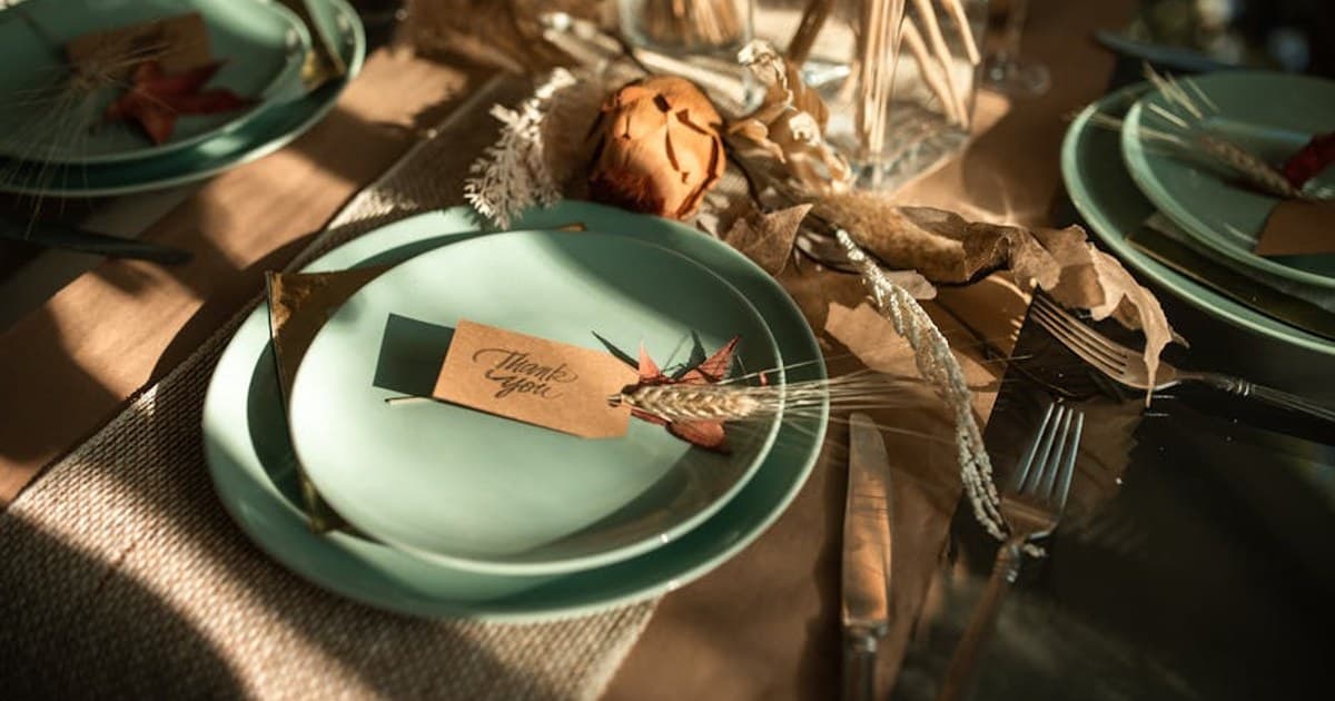 Inviting Thanksgiving table arrangement featuring autumn-themed elements with a warm and elegant touch.